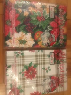 Brand new vinyl Christmas table cloth 52” X 70”