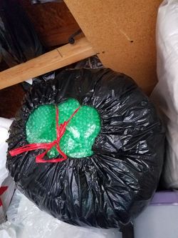 wrapping papers, bubble wraps for breakable items 1 small trash plastic full of packing materials bubbles, papers, air pillows $5 per bag