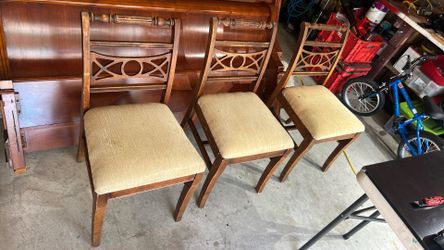 3 antique wooden chairs.