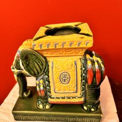 The image displays a Mid-Century Modern Chinoiserie Ceramic Emerald Green Elephant Ashtray