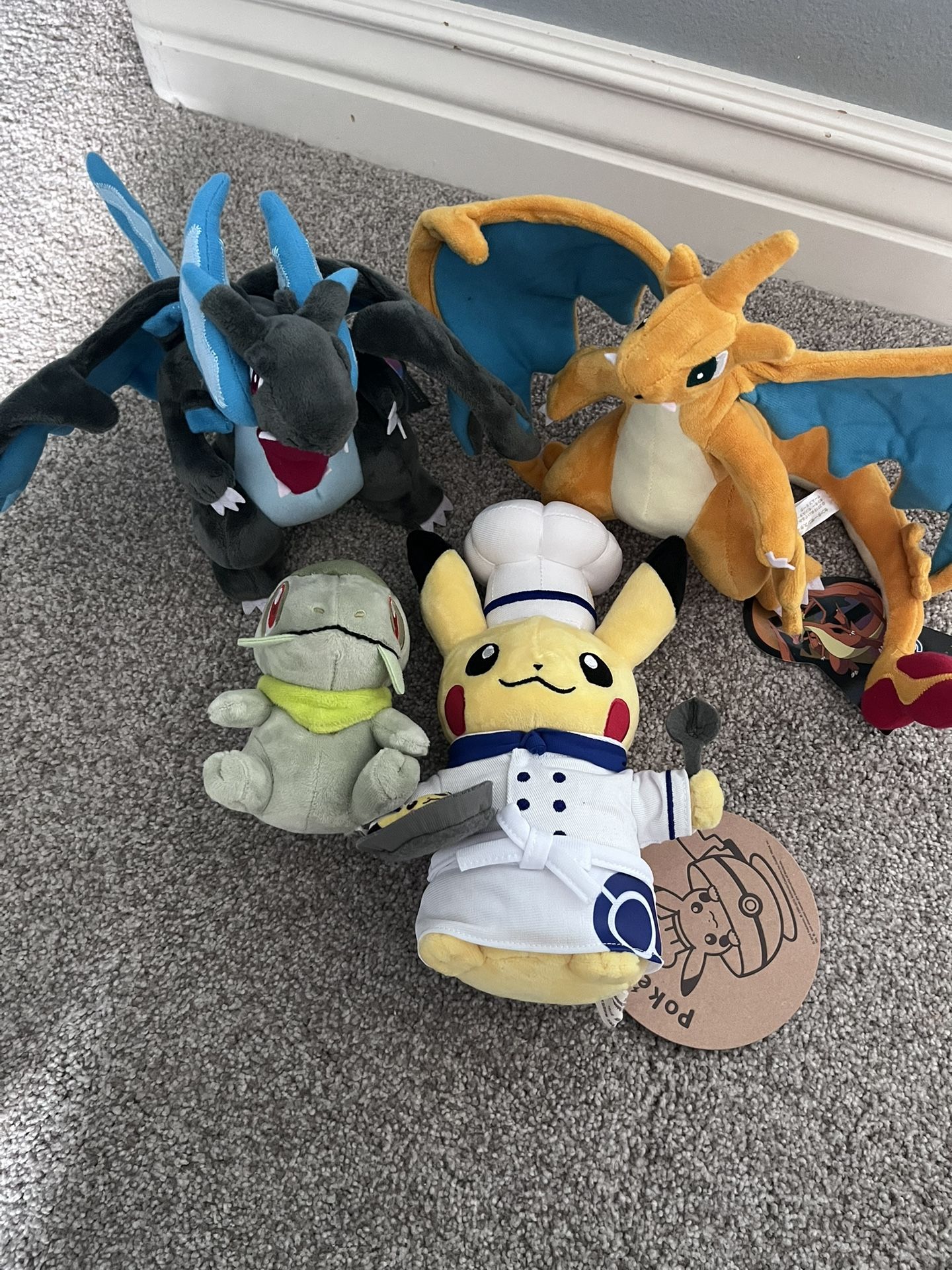 POKEMON CENTER AND CAFE ASSORTED PLUSHIES MEGA CHARIZARD X AND Y CHEF HAT PIKACHU AND AXEW
