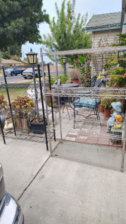 Two heavy duty metal shelves,one stainless steel, ok ne black