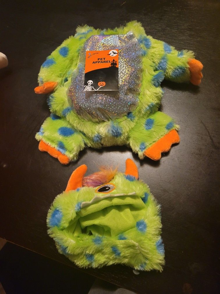 Brand new dog Halloween dog costume size small. Dog tried it on and is too small. One eyed monster..