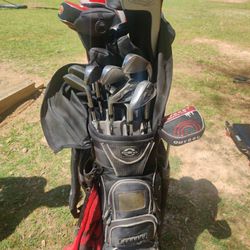 Fully Accessorized Golf Caddy With The Golf Clubs All Sorts And All Kinds Different Sizes 