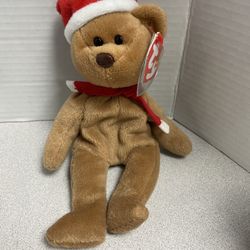 Ty Beanie Baby 1997 Holiday Teddy bear, the first Christmas-themed Beanie Baby. 