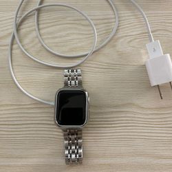 Apple Watch Series 4 40mm with charger, wall brick, and 3 straps
