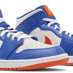  Air Jordan 1 Mid Knicks comes in a game-royal, rush orange-phantom-white color palette. 