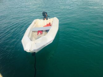 Plastic skiff with 2.5 outboard Mercury motor