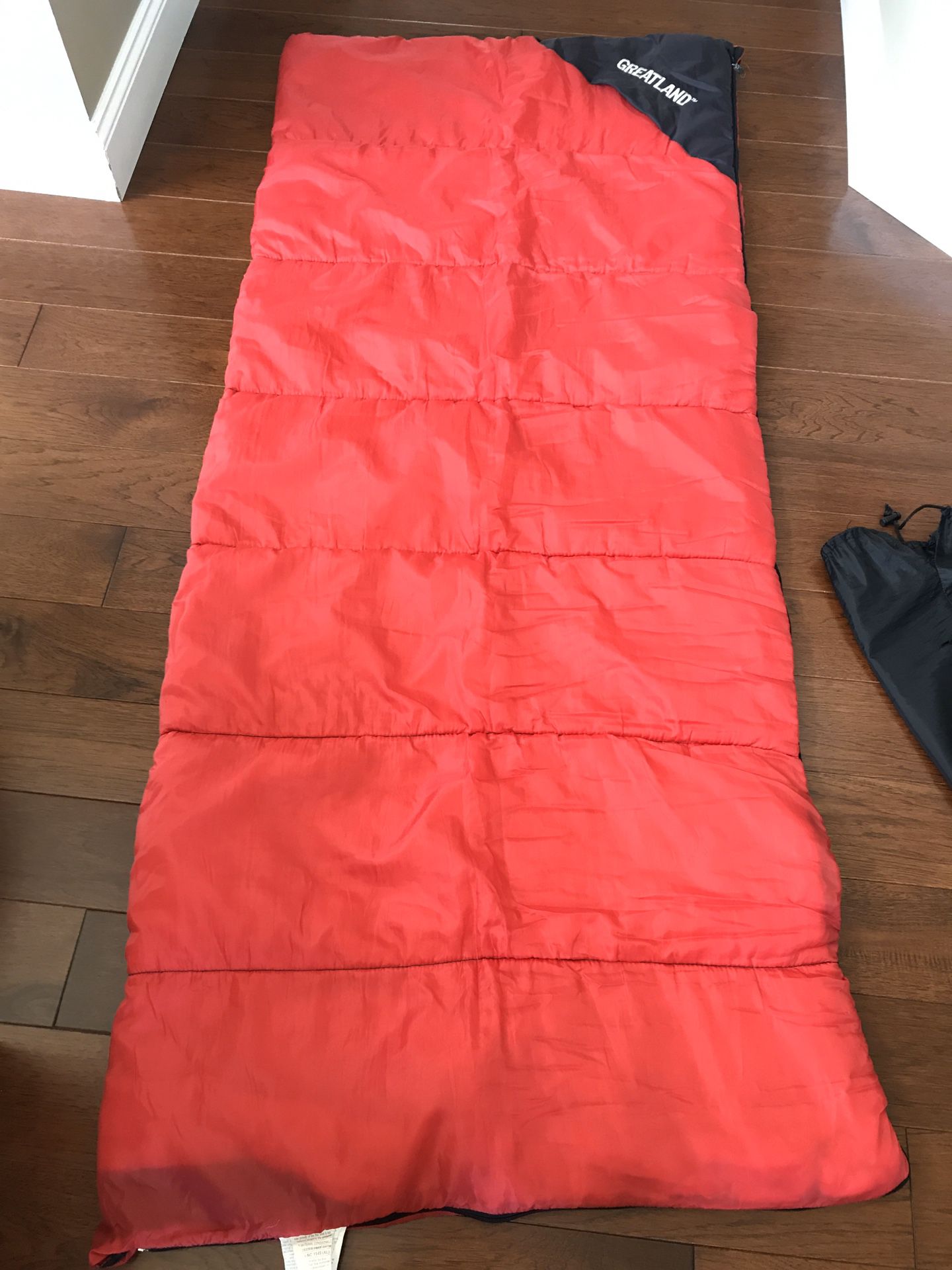 Rectangular sleeping bag with stuff sack