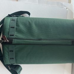 A green canvas insulated wine tote, suitable for picnics and outdoor events