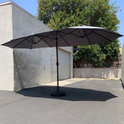 $130 (New) Large 15ft double sided outdoor umbrella w/ 65 lbs plastic weight base (red/gray)