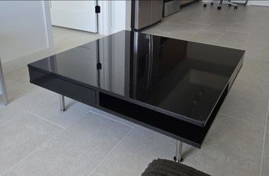 glossy black IKEA Tofteryd coffee table