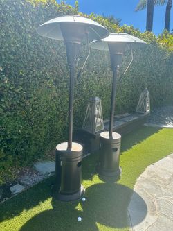 Patio Heaters with covers and propane tanks