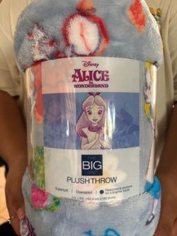 a Disney Alice in Wonderland Oversized Plush Throw by The Big One, measuring 5 ft. x 6 ft