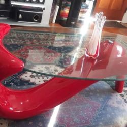 Modern Elegant Coffee Table with oval glass top and designed red base
