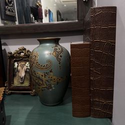 Vintage Decorative blue ceramic vase features hand painted detailed paisley pattern and serves as a stylish home decor item. 