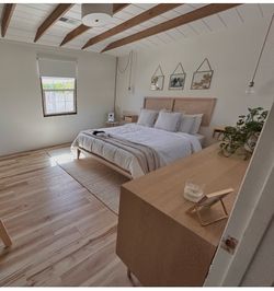 Queen bed frame with detached cane-webbing headboard and floating nightstands