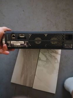 Xbox 360 with two games and a two pack battery charger