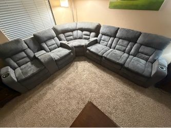 Grey power reclining living room set: couch, loveseat, corner wedge