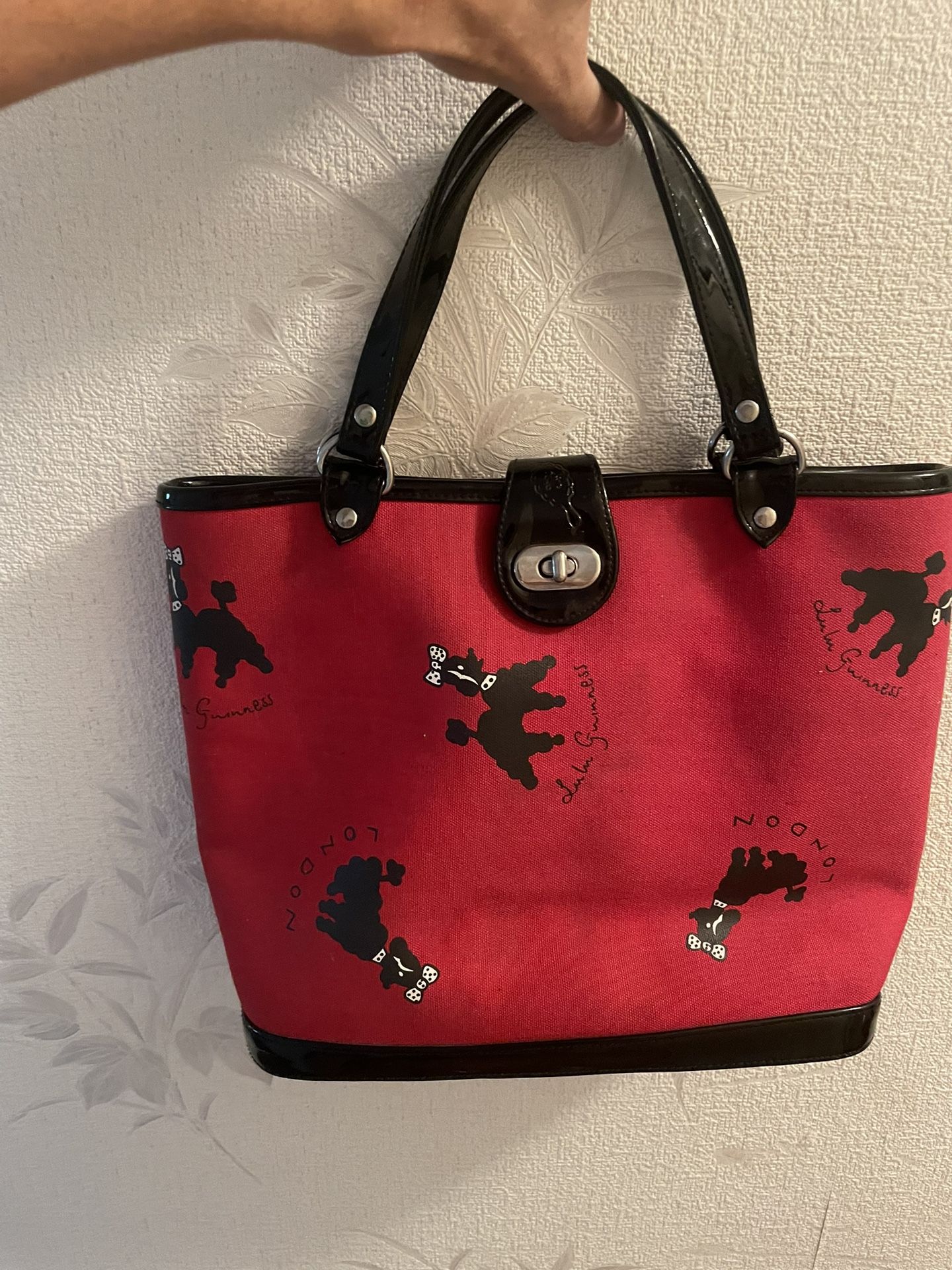 Lulu Guinness, red purse with black dogs on it perfect condition