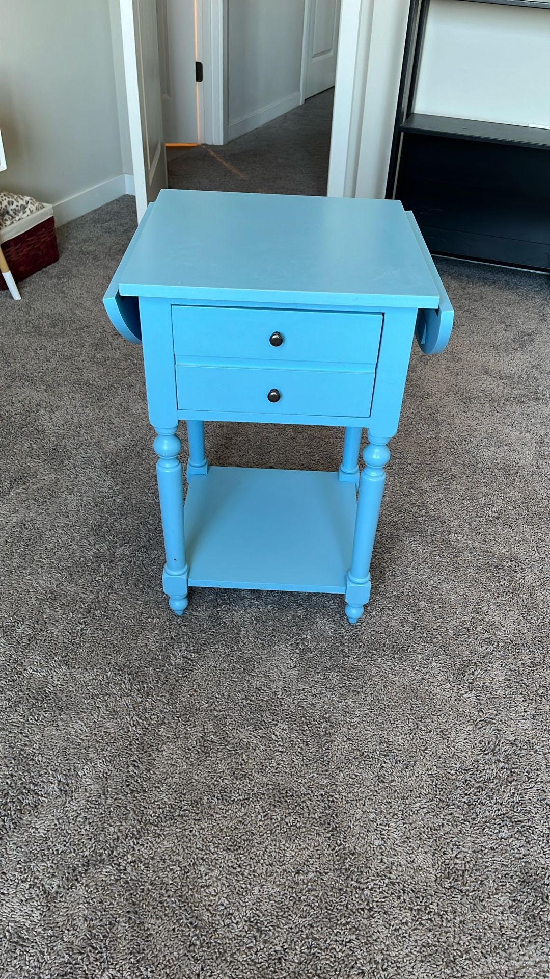 Small Teal Table With Extendable Flaps.