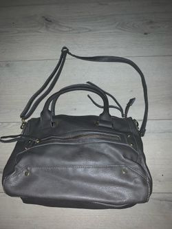 Erica Anenberg’s gray leather cross body satchel