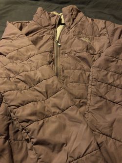 Woman’s north face thin jacket size L .
