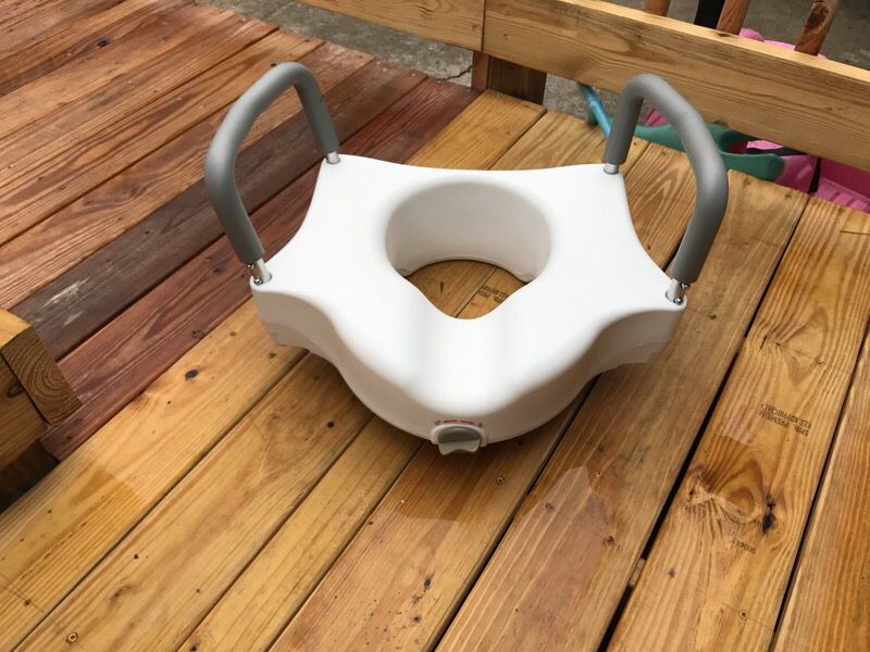 Raised toilet seat