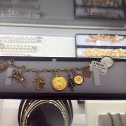 14kt Charm Bracelet 30.9 Grms 