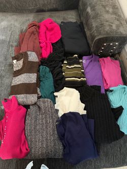 Sweaters in various sizes and other clothing—the whole bag for $10.