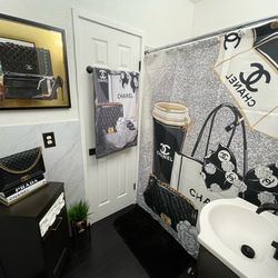 Shower curtain, towel and picture on wall