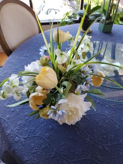 Faux flower bouquet on blue vase