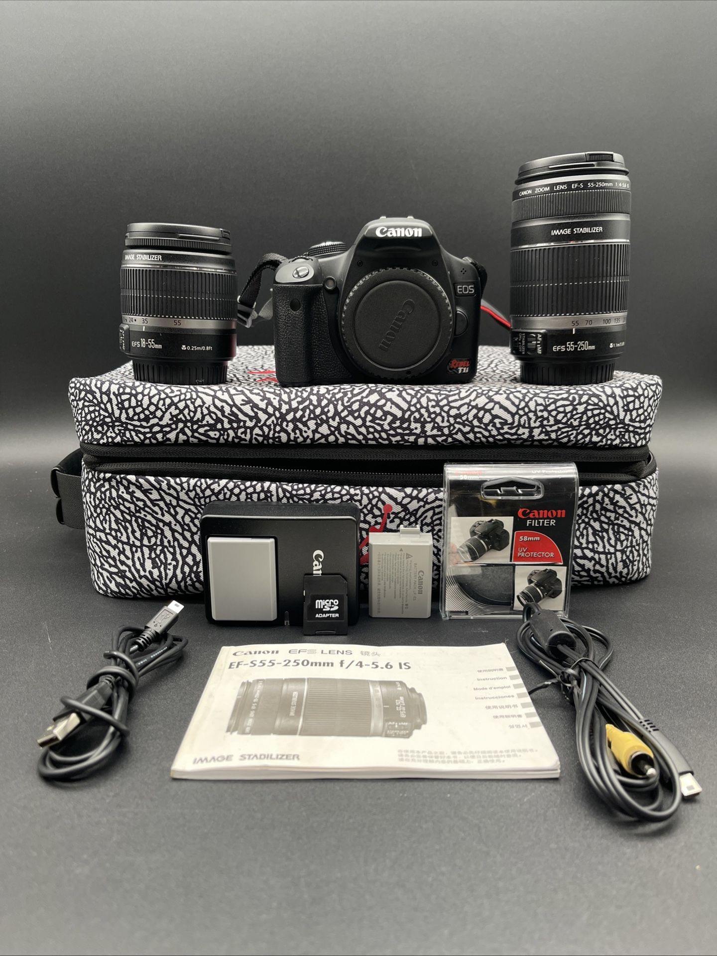 Canon EOS Rebel DSLR 15.1 MP Camera with 3-Inch LCD, Lens, And Carry Case