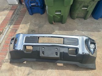 Chrome front bumper Chevrolet Silverado hd trucks.  This unit is made of steel with a chrome finish and black plastic trim.  It includes integrated fo
