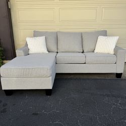 Gray Reversible Living Spaces Sectional Couch Sofa