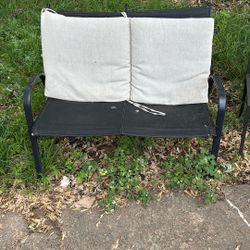 Lawn furniture, two chairs, and a bench