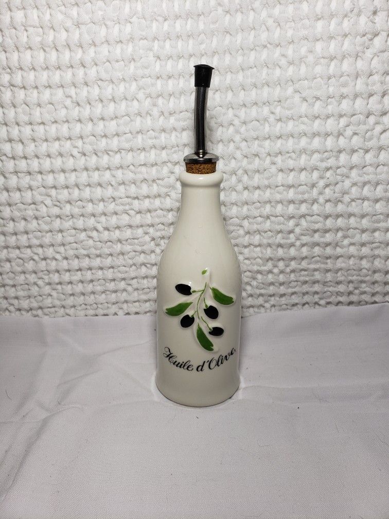 Revol La Provence Cream Porcelain 8.75 Ounce Olive Oil Bottle.  Good condition and smoke free home.  Measures 10 " tall .