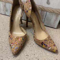 Jessica Simpson cork pumps featuring a multicolored paint splatter design and a pointed toe