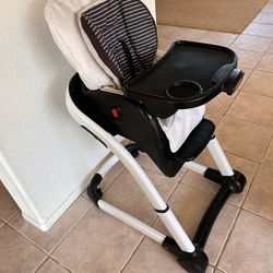 Adjustable Rolling Baby High Chair.  $50 Firm.