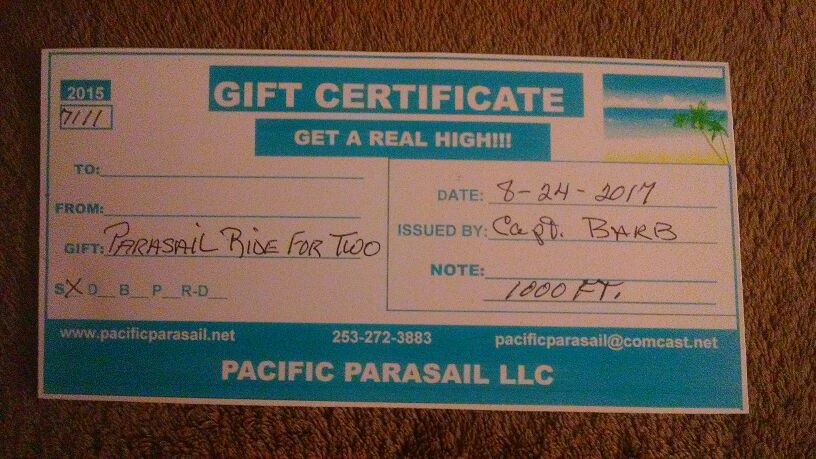Ticket for 2 to go parasailing a 1,000ft in air also pictures and a sd card with photos