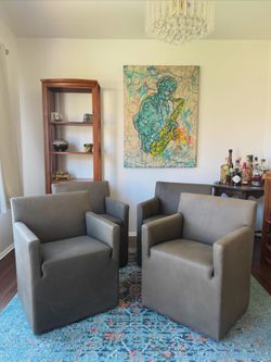 Leather Swiveling Club Chairs