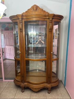 Large Vintage curved glass lion carved oak china curio cabinet