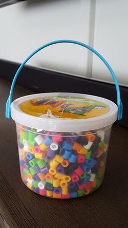 Bucket of kids crafting beads