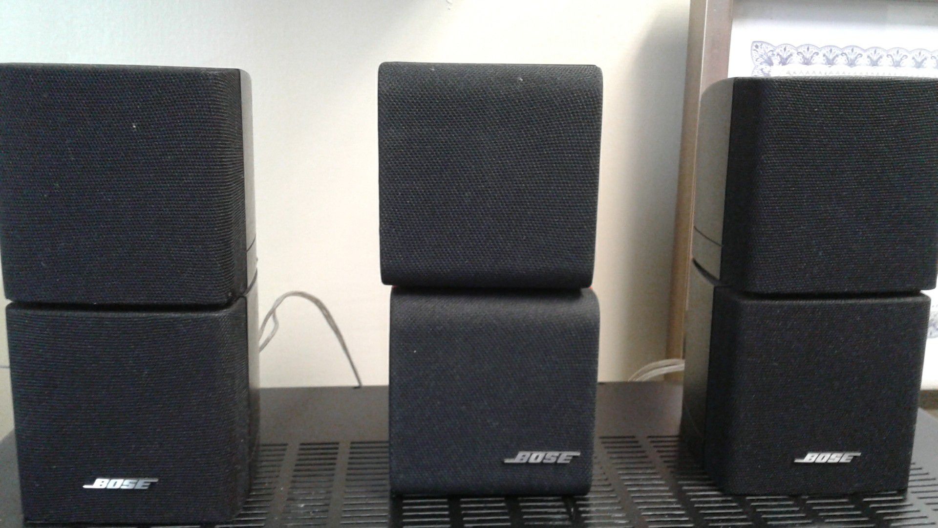 (3) Bose double cube speakers.