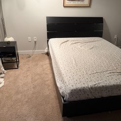 Black bed frame with headboard an storage space 