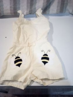 One piece body suit size 4  is bright yellow with white. $3.00