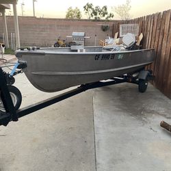 12ft Alumacraft Boat & Trailer.