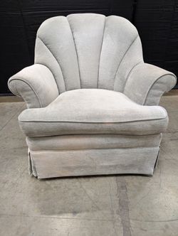 Textured Upholstered Scalloped Back Swivel Armchair