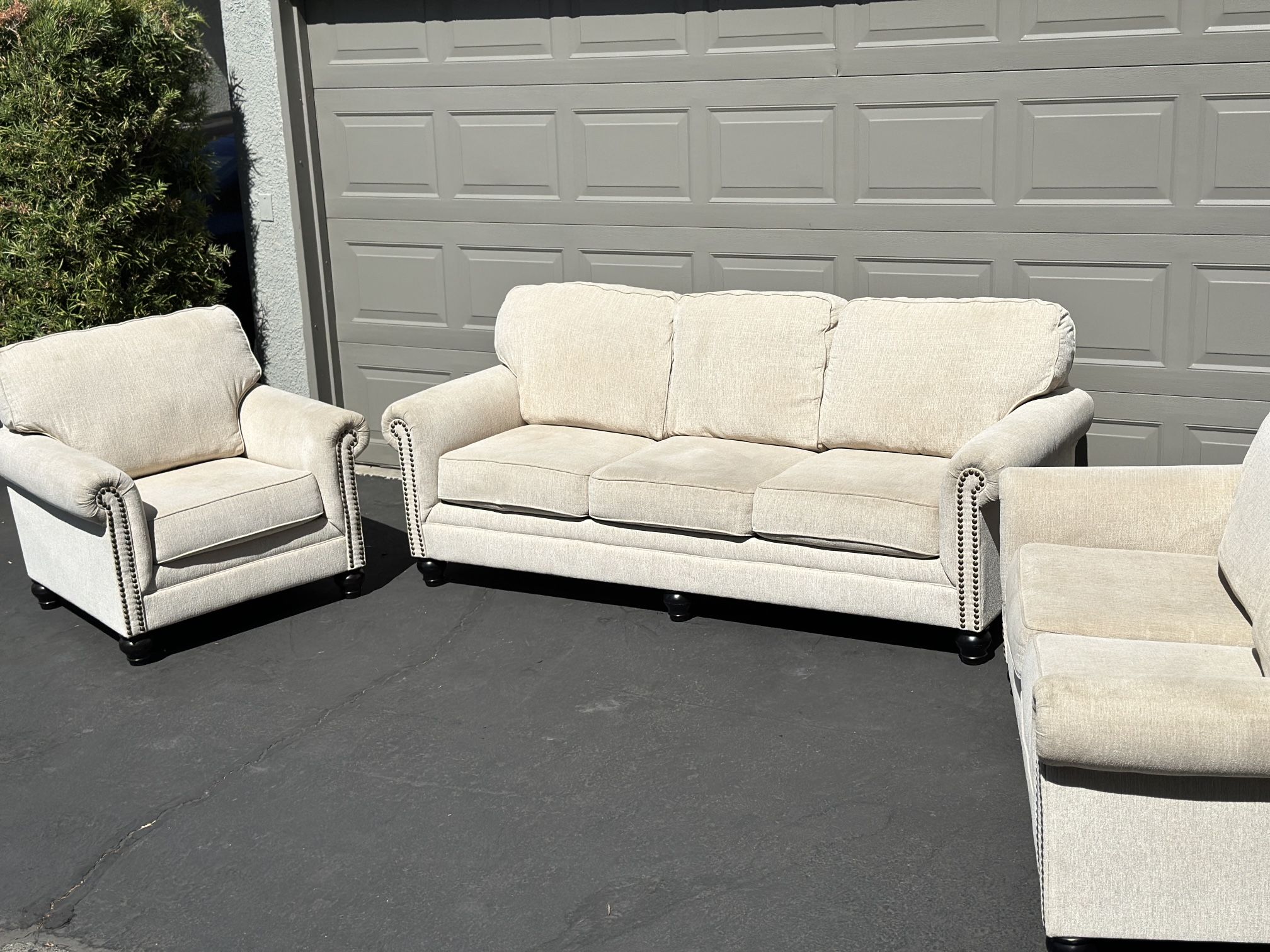 Ashley‘s Furniture Beige Three-Piece Couch Set - Couch, Loveseat, And Chair