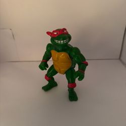 Teenage mutant ninja turtles Raphael action figure with red mask and yellow shell